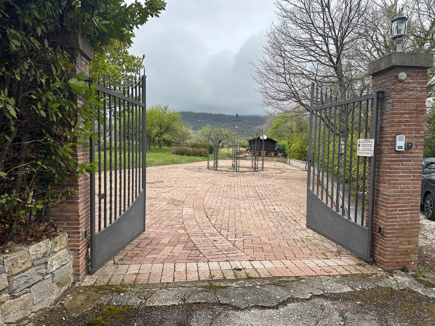 Entrance gate and paved courtyard — 1329