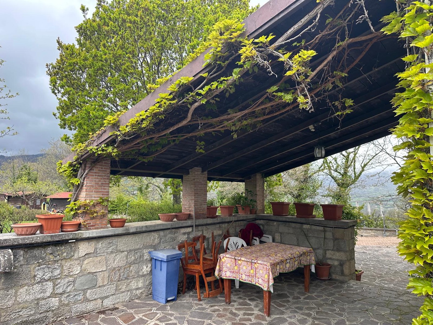 Covered outdoor gathering area — 1329